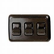 A black multi-purpose switch with three rocker switches on a black panel.