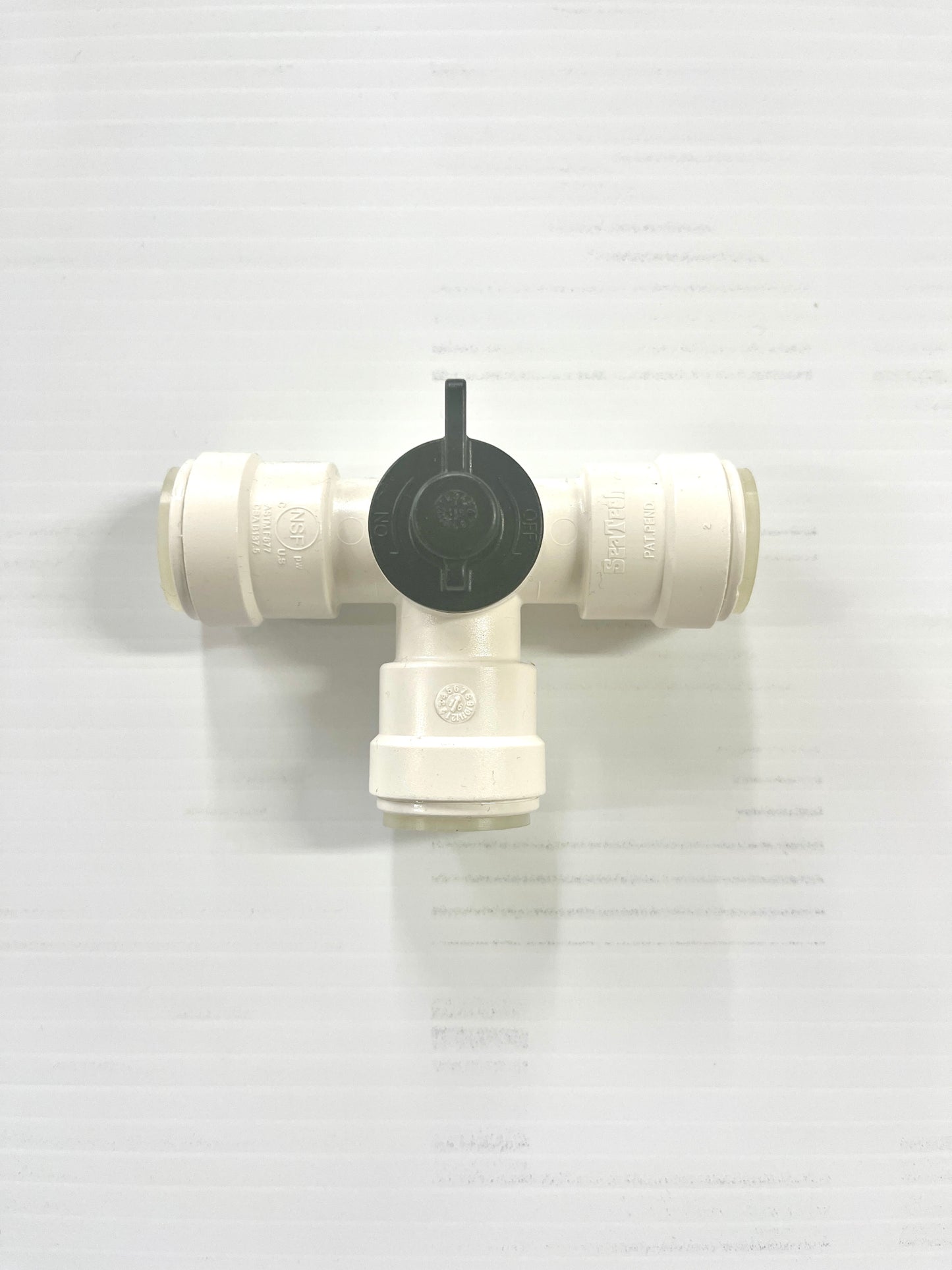 A white 3-way by-pass valve with copper tube ends, designed for plumbing systems.