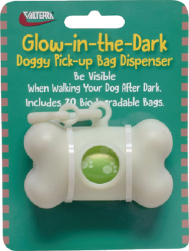 Glow-in-the-dark dog bag dispenser on a green cardboard backing, with a white and green plastic dispenser, and includes 20 biodegradable bags.
