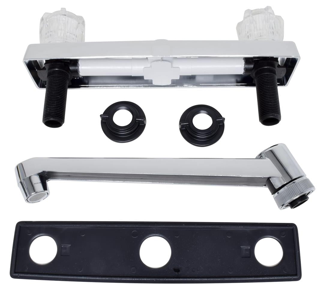 A set of kitchen faucet components laid out on a white background, including a chrome-plated bar deck mount, a D-shaped spout, two clear crystal acrylic knob handles, and a black plastic compression valve.