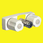 A white exterior spray port faucet with two white knobs on the handles and a metal connector on the outlet.