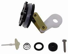 A collection of various pump parts laid out separately, including a piston, suction cup, brass rivet, and other components of a rocket pump.