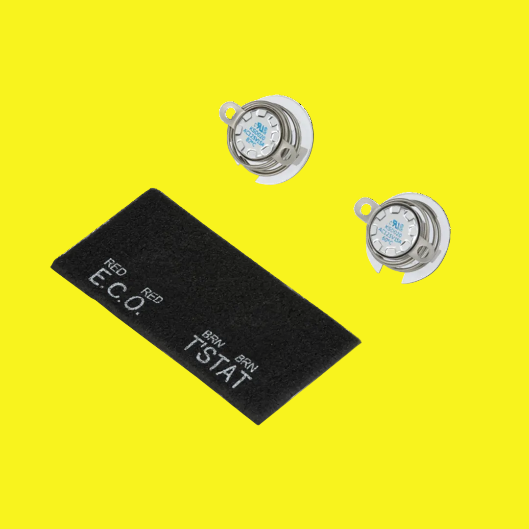 Two round silver water heater thermostats with black detailing and a black rectangular label with 'RED' and 'ECO' text, indicating temperature settings.