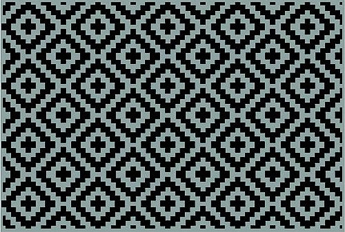 Patterned rug with black and white geometric design.