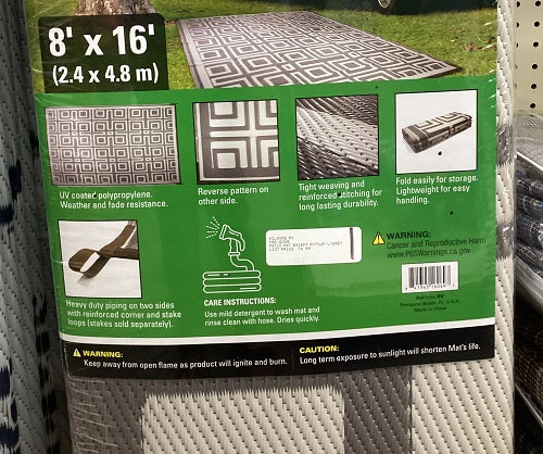 Gray and white outdoor patio mat