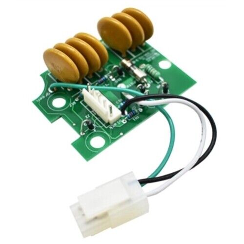 A surge protection device with a green circuit board, three brown capacitors, and a black wire with a plug.