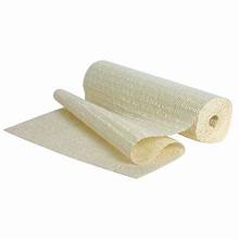 A roll of cream colored slip stop material, unrolled to show texture, typically used for preventing items from sliding in vehicle safety applications.