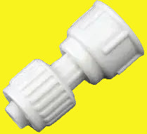 White plastic fitting on a yellow background