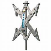 A silver-colored X-Chock tire locking chock with a ratchet wrench, designed for use with tandem tires.