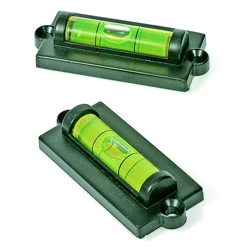 Two black levels with bright green vials, shown from different angles on a white background.