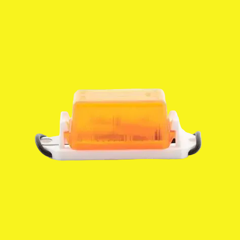 An amber colored clearance/side marker light