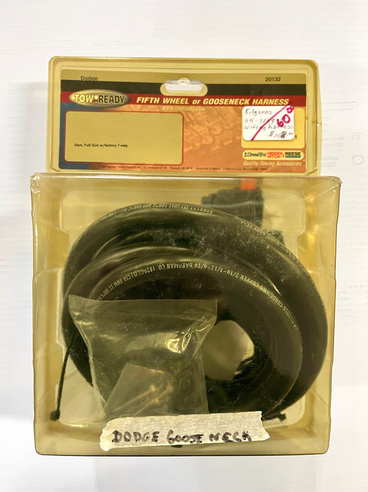 A fifth wheel and gooseneck harness for towing an RV.