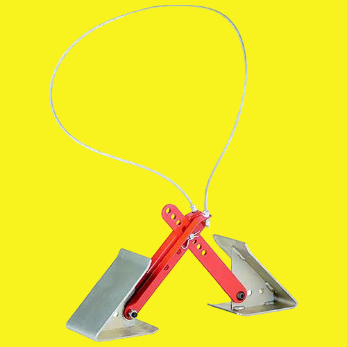 A one-step wheel chock with red brackets and chrome feet