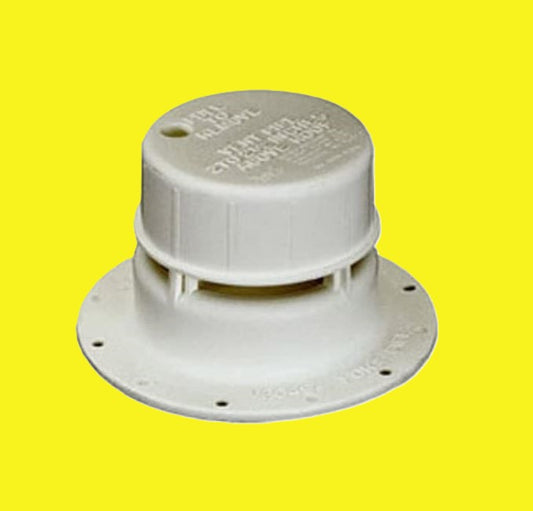 An off-white plastic plumbing vent cap on a yellow background.