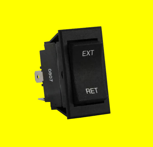 Black switch with 'EXT' and 'RET' labels on a white background