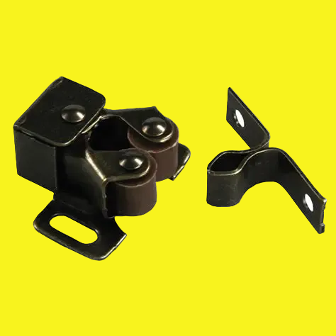 A pair of dark metal hardware components, including a roller bracket assembly and a separate bracket piece, shown on a plain yellow background.