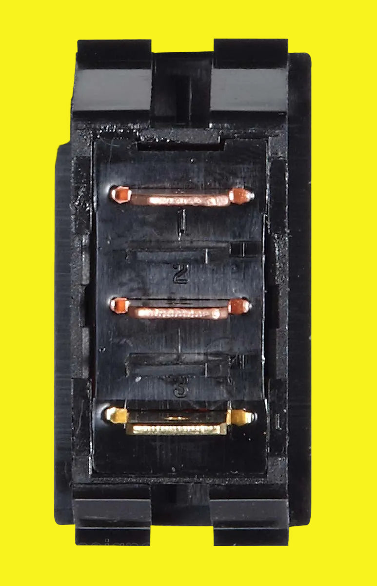 Black electrical connector with metallic contacts on a yellow background