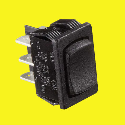 Black rocker switch with six wire terminals. 