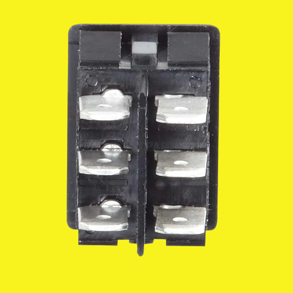 A black electrical switch with six terminals on a yellow background.