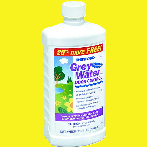 A bottle of Thetford Grey Water Odor Control, 24 oz, shown against a solid bright yellow background. The product is in a white plastic bottle with a white cap, featuring a colorful label with red, blue, green, and purple elements.