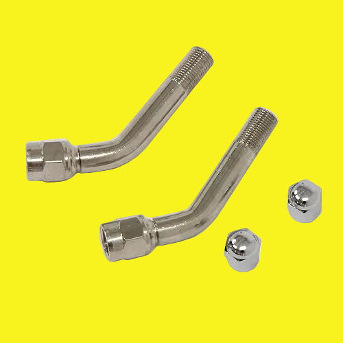 A set of metal tire valve extenders with nuts on a yellow background.