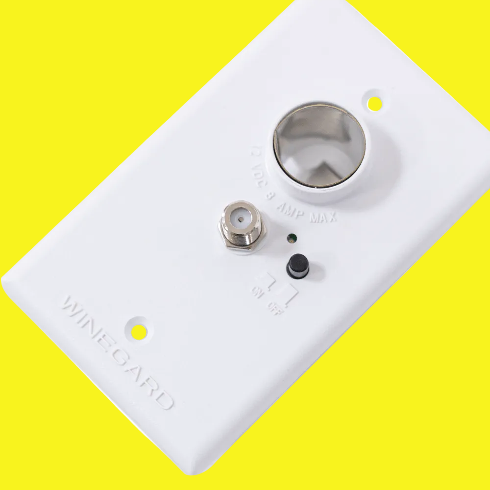 A white wall plate power supply for cable or tv antenna