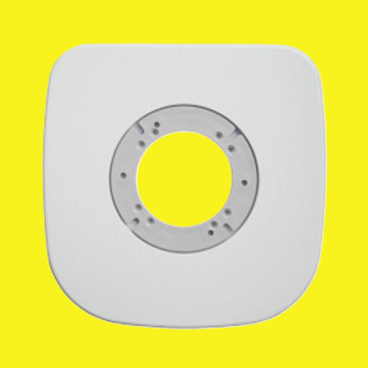 A square white toilet mount plate with rounded corners and a circular mounting hole in the center, shown against a solid bright yellow background.