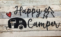 Linen and rubber mat with 'Happy Camper' text and camper silhouette on a rustic background