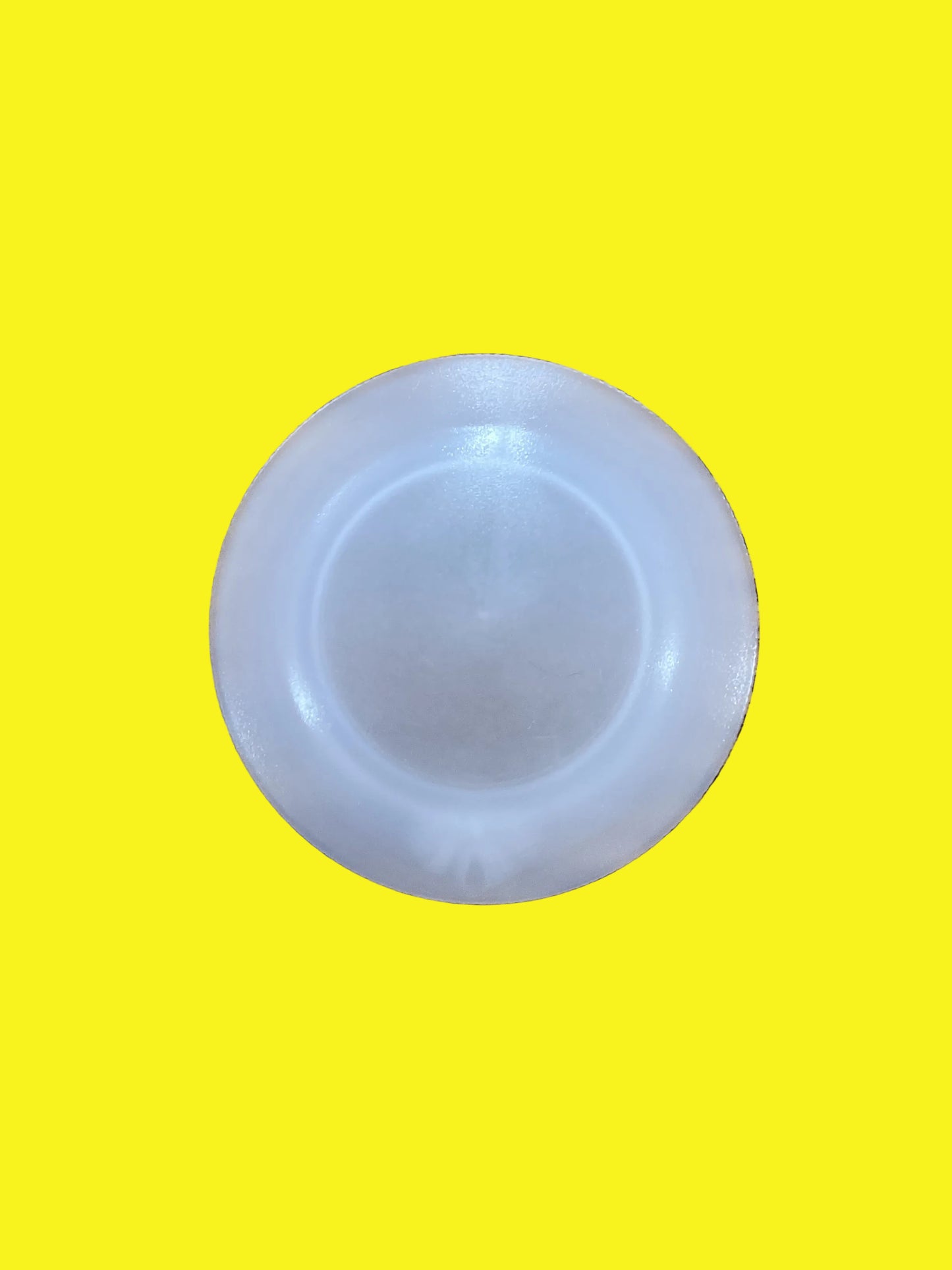 A clear plastic lens for a recessed light