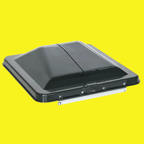 A black wedge shaped RV roof vent lid. Showing a metal hinge.