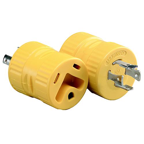 Two yellow electrical plugs on a white background