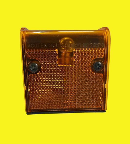 An orange amber clearance light for vehicles, with visible mounting screws, placed against a white background.