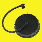 A black plastic cap with an attached black hose, shown on a plain yellow background.