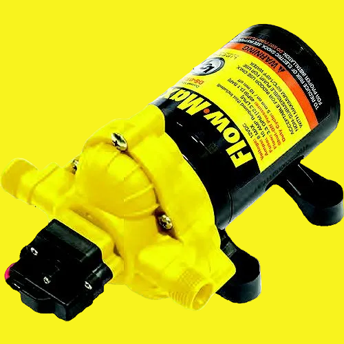 A small yellow and black electric pump with a warning label, shown on a plain yellow background.