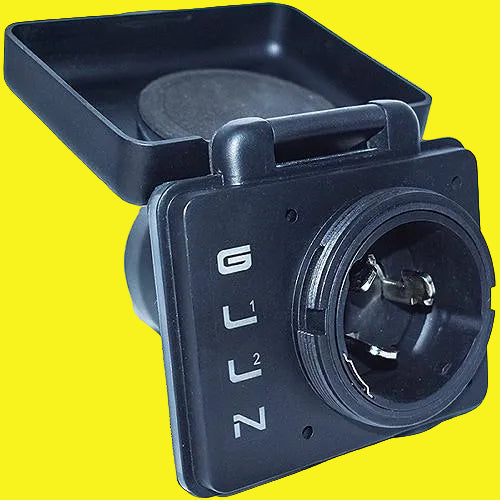 A black plastic electrical connector component with a square housing, a circular multi-pin socket on the front, and a rectangular cover piece on top. The front face has white lettering indicating terminal positions 1, 2, and 3.